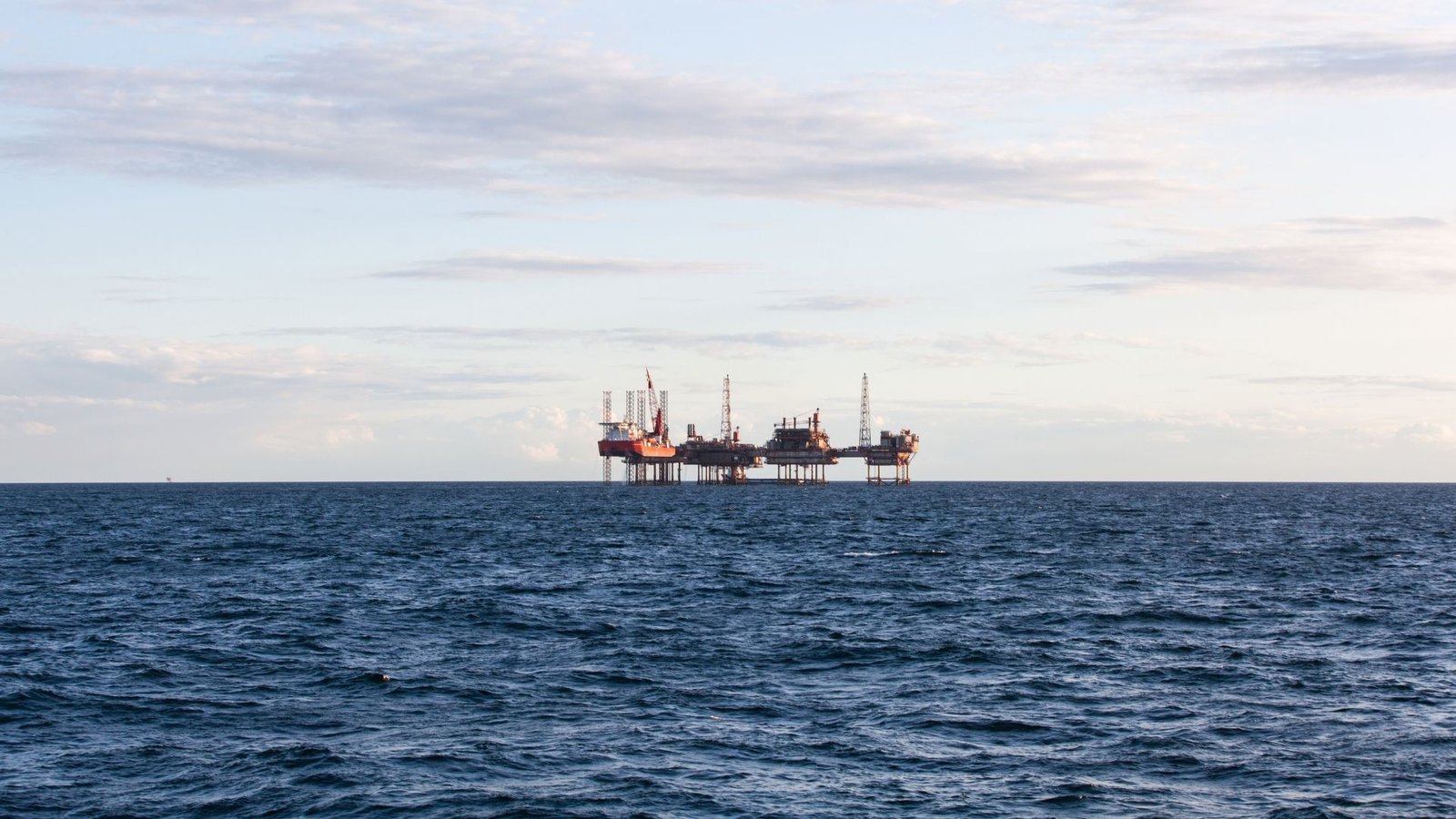 Offshore platform on the horizon at sea.
